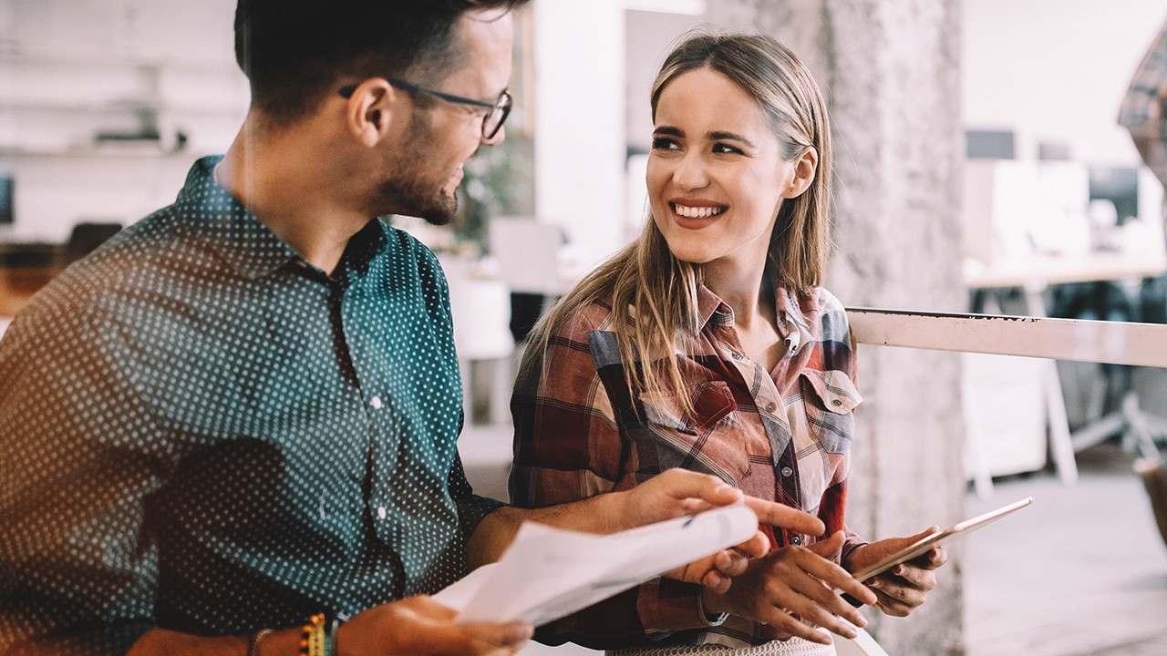 Relaxed professional conversation between a man and a woman