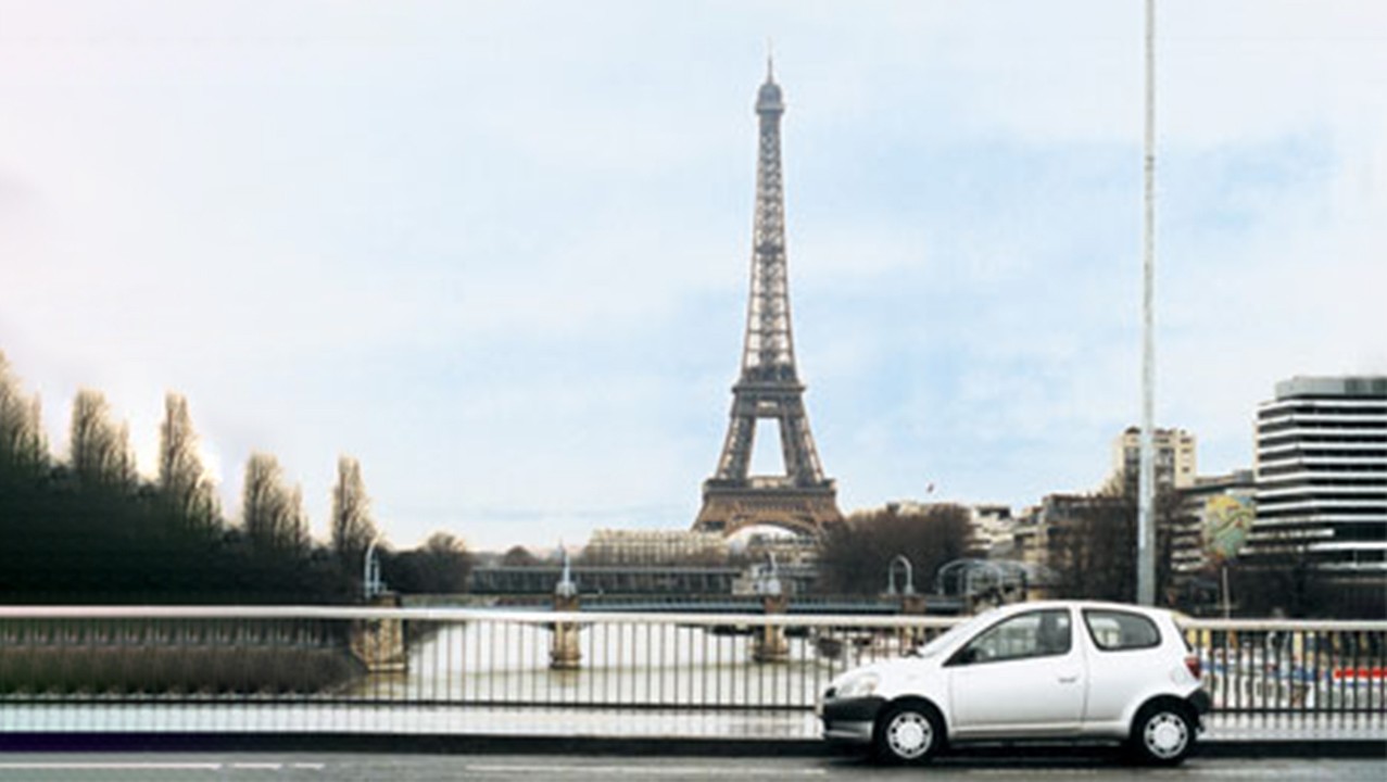 Toyota Yaris with Eiffel tower in background