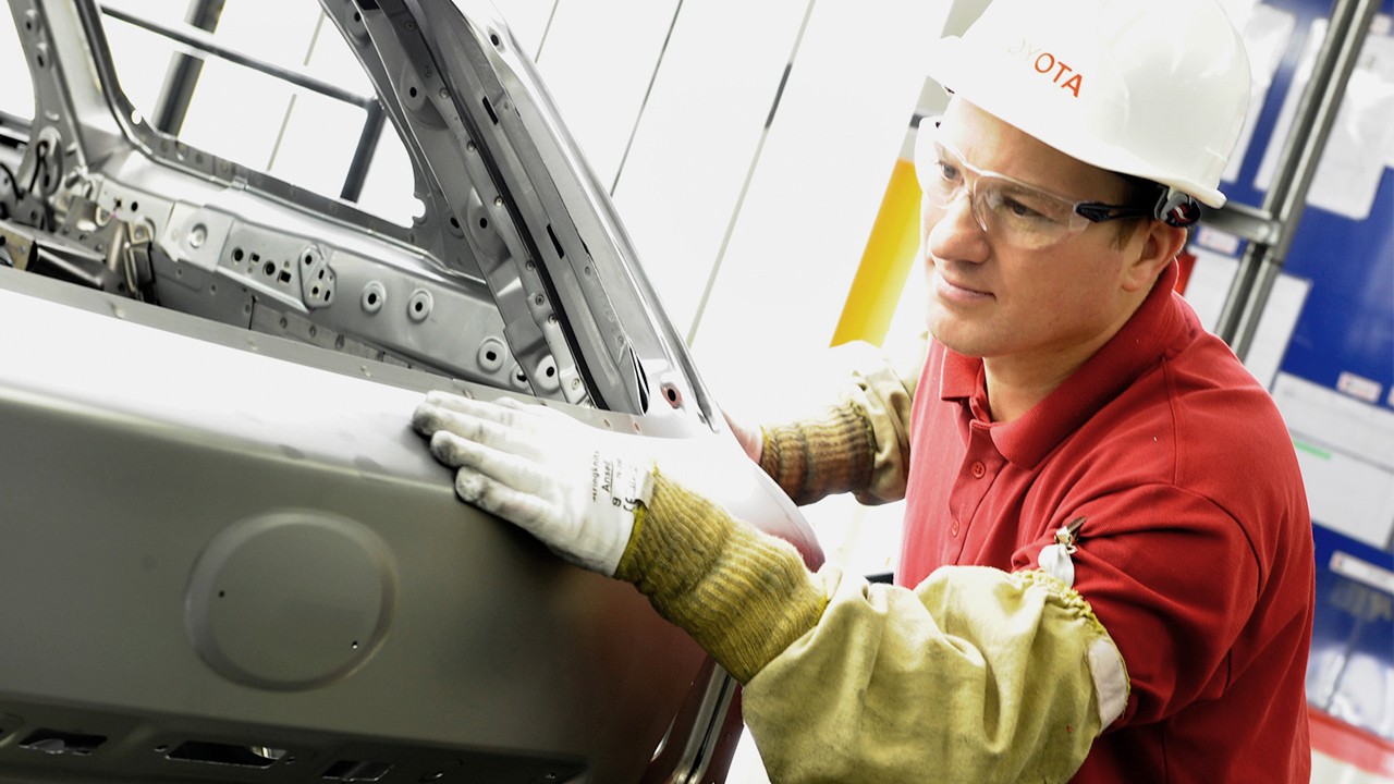 Toyota worker checking Carina E 