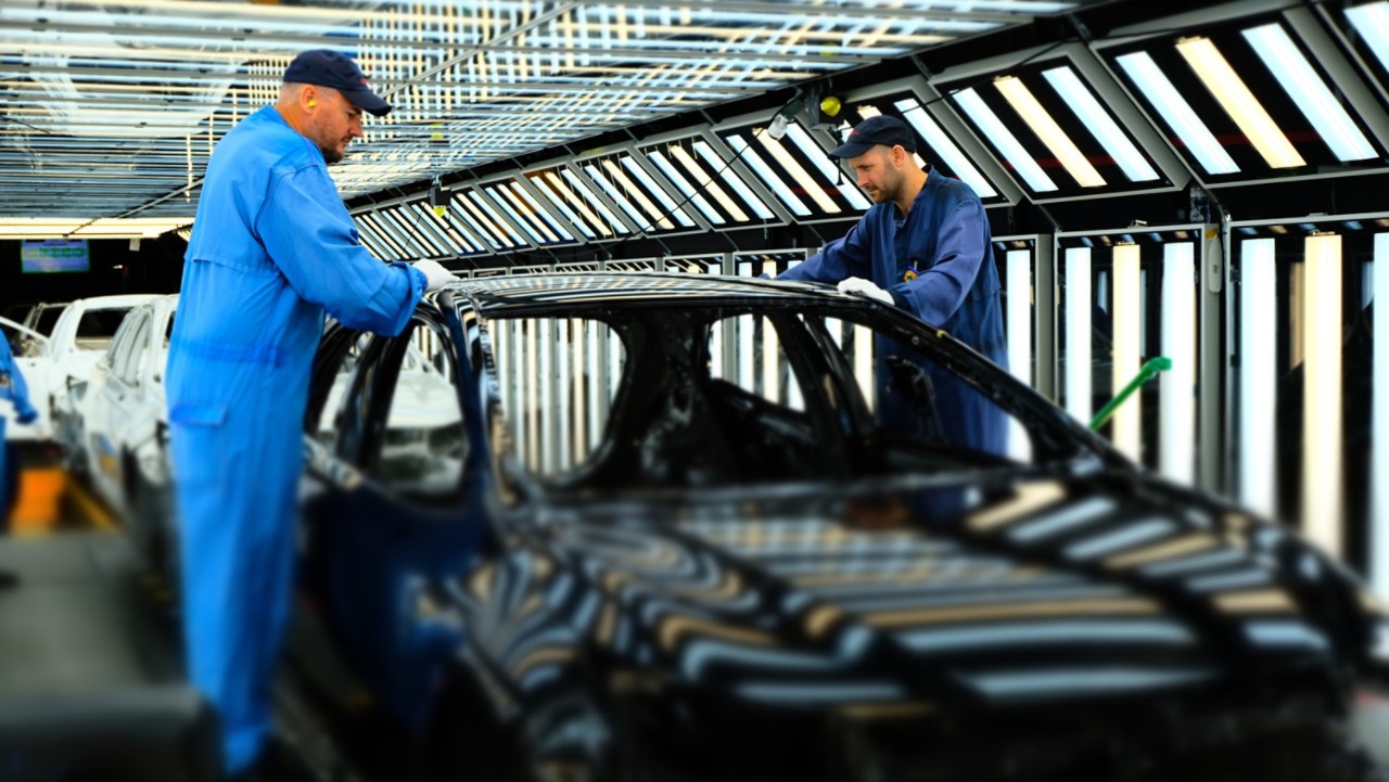 Toyota technicians working on a Toyota engine