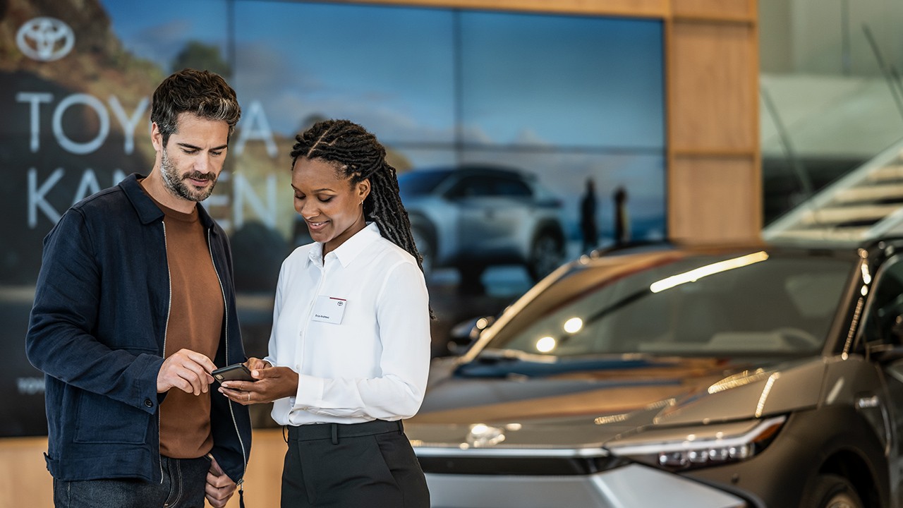Toyota saleswoman interacting with customer