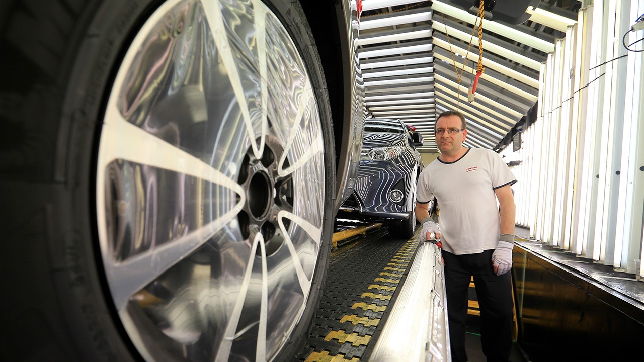 Toyota factory worker checking quality 