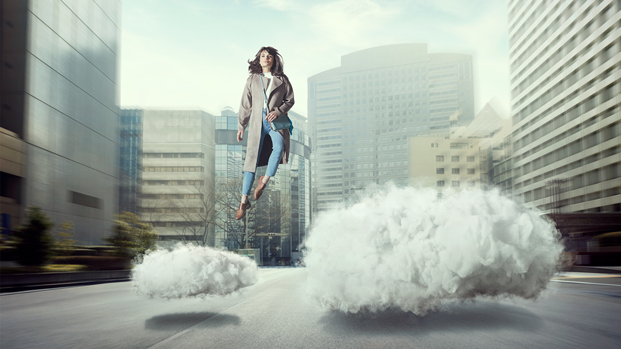 Woman jumping from one to another KINTO cloud