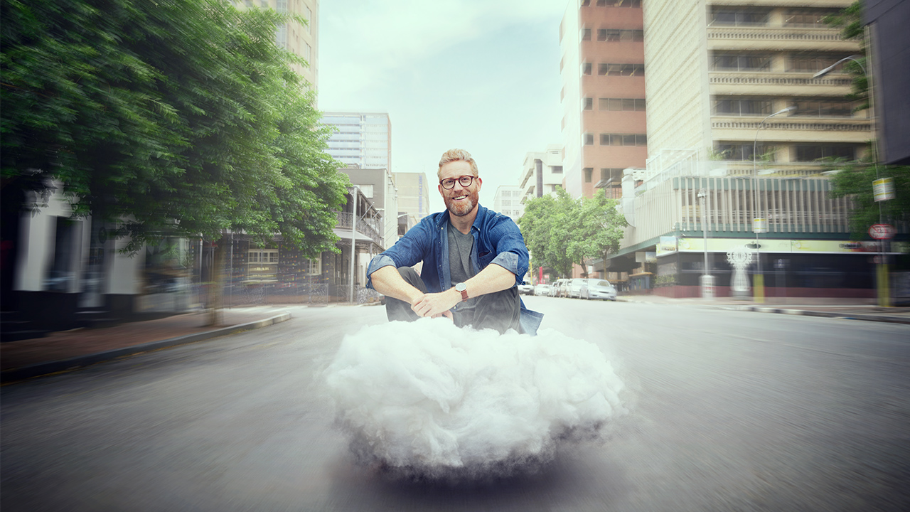 Man sitting on a KINTO cloud