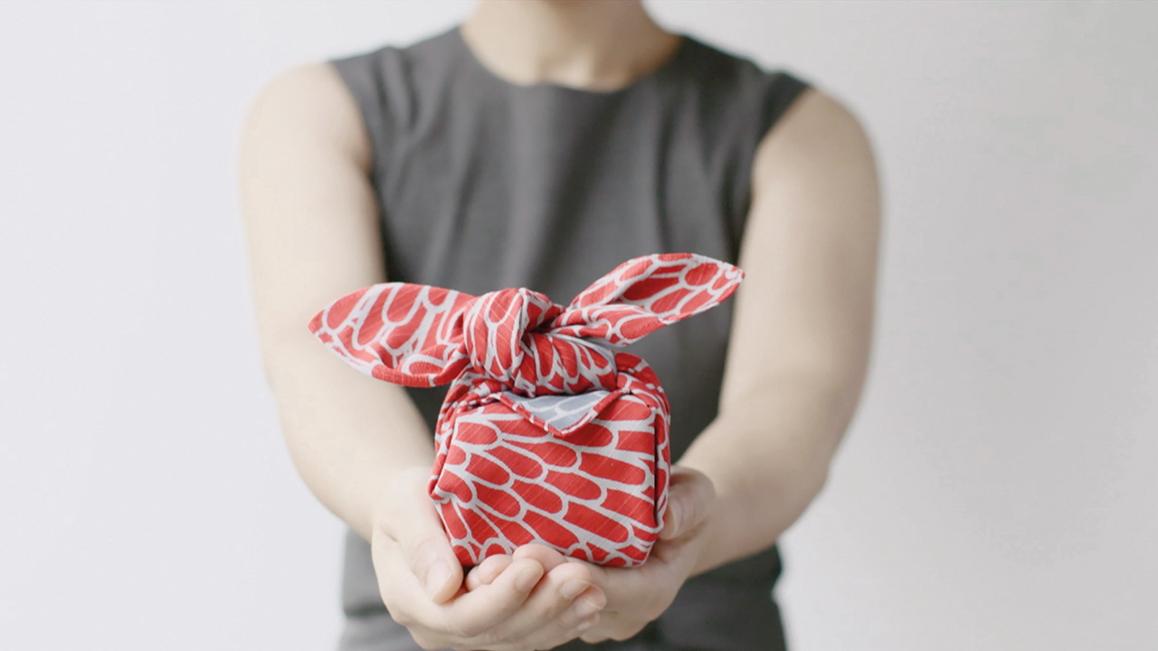 Woman holding furoshiki gift