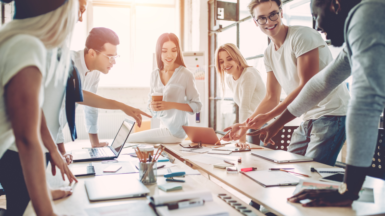 Business people with different nationalities joining their hands