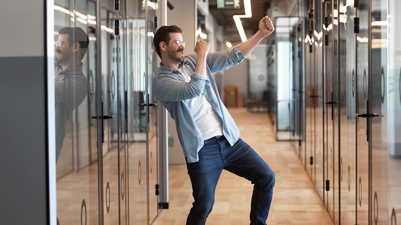 Cheering businessman at the office