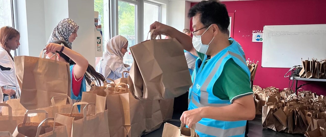 Toyota executive preparing bags to be shared with the homeless in Brussels - hero