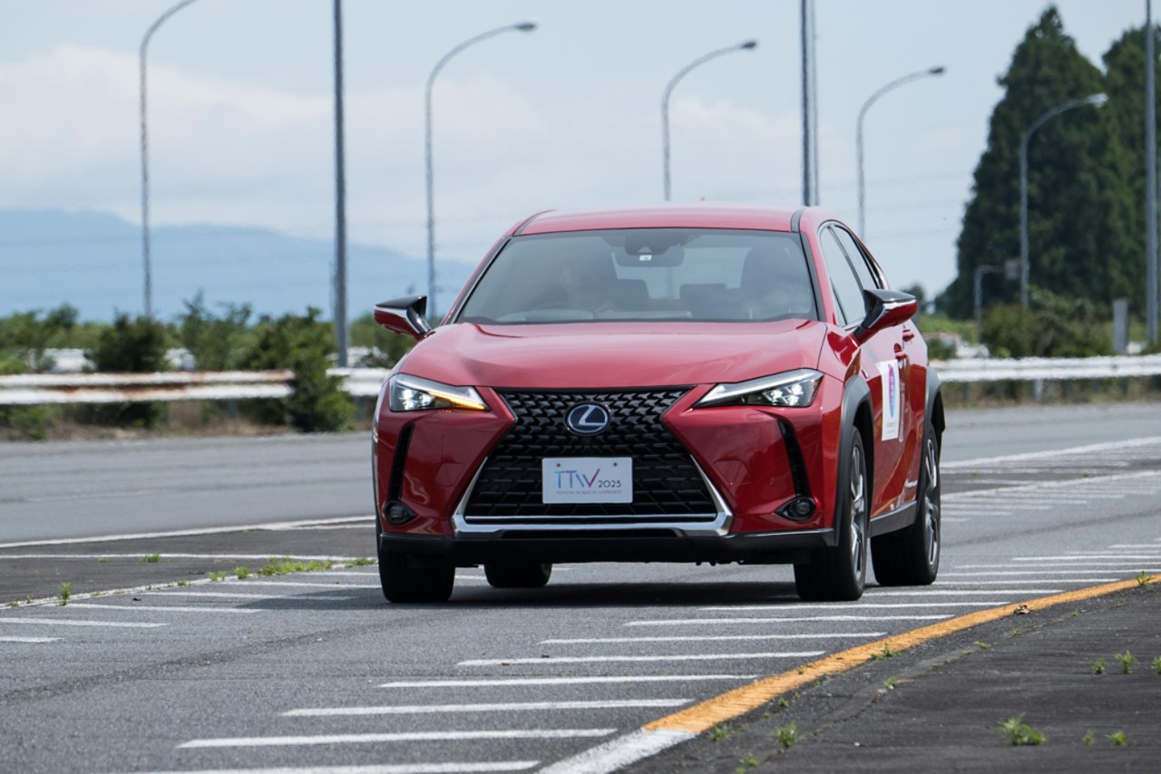 Red Lexus BEV car with manual transmission