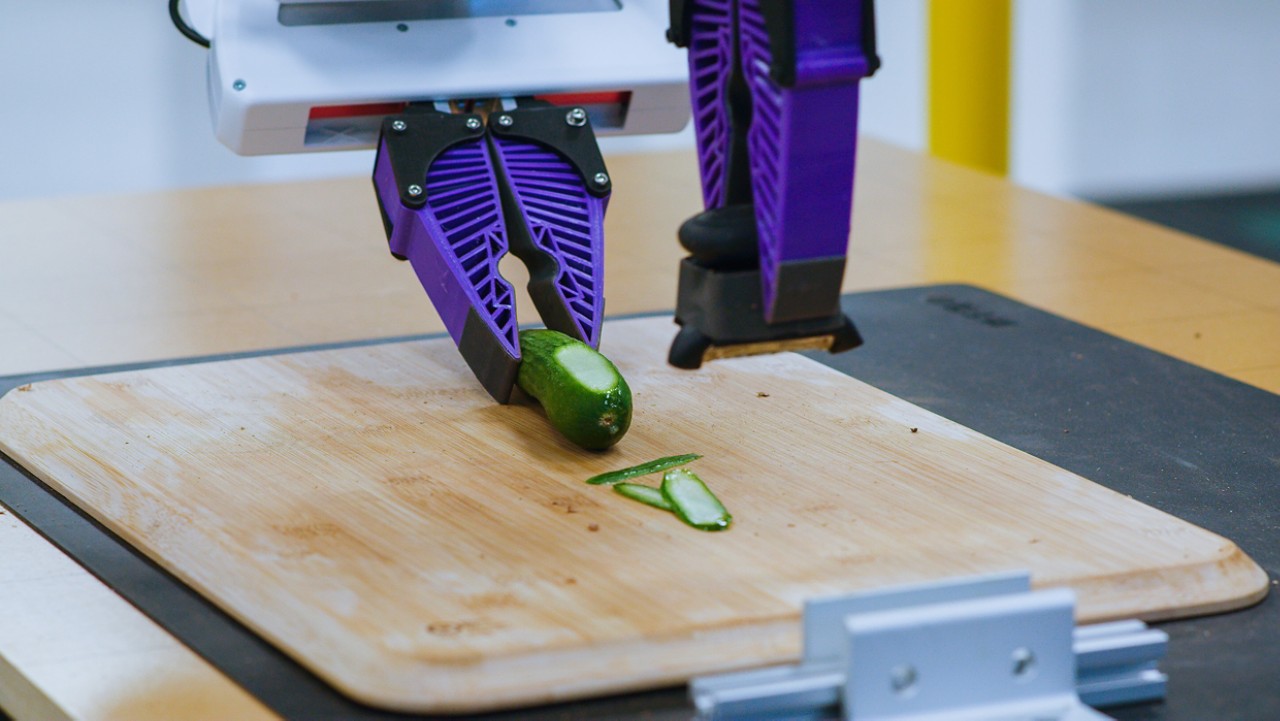Robot peeling a cucumber