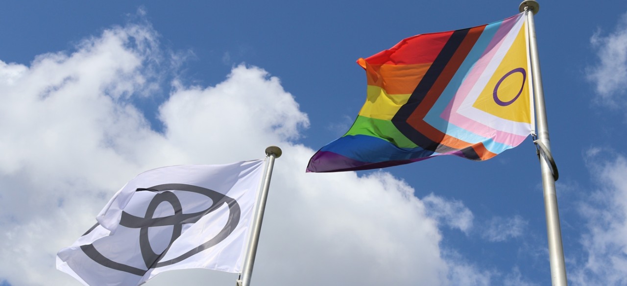 Toyota flag alongside the LGBTQi+ flag